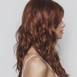Red wavy wig showcasing natural texture and vibrant color for stylish looks.