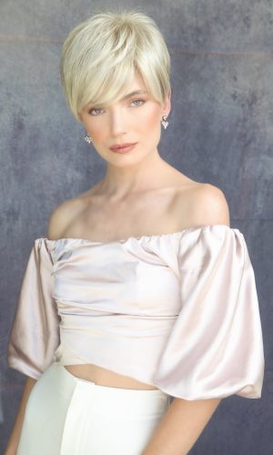 Elegant short blonde pixie wig on a woman with a stylish off-shoulder top.