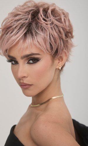 Short pink curly wig with layered texture and volume for stylish looks.
