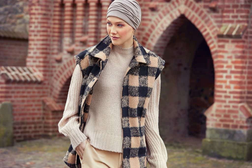 Woman wearing a Mila Turban and stylish fall clothing outdoors.