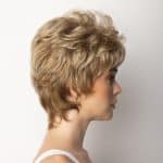 Short blonde wig styled on a woman with side profile view.