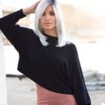 Elegant woman with platinum blonde bob wig from Hidden Secrets Wigs.
