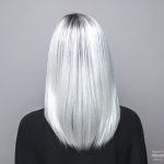 Silver bob wig with straight hair, front view, on a mannequin head.