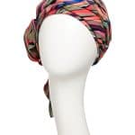 Vibrant multicolor printed boho turban on mannequin head.