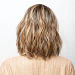 Wavy blonde bob wig from Hidden Secrets Wigs, styled for a natural look.