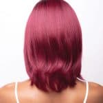 Vibrant pink wig with sleek, straight style for a bold look.