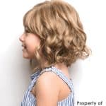 Blonde curly wig from Hidden Secrets Wigs, styled for a natural look.