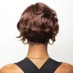 Short, wavy, auburn wig from Hidden Secrets Wigs, styled for a natural look.