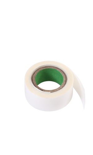 White medical tape roll with green core for medical use.