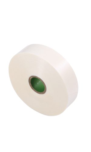 White medical tape roll with green core for medical use.