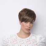 Short brown pixie wig with layered bangs for a stylish look.
