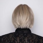 Blonde bob wig styled for elegance, perfect for sophisticated looks.