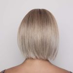 Blonde bob wig from Hidden Secrets Wigs, styled for a sleek look.