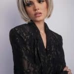 Fashion model wearing Aria wig with blonde bob hairstyle.