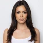 Elegant woman wearing a natural-looking wig from the Amore Collection.