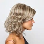 Blonde wavy wig from Hidden Secrets Wigs, styled for a natural look.