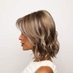 Side view of Briar Noriko Collection wig with blonde highlights.