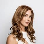 Beautiful woman wearing Brittany wig from Amore Collection by Hidden Secrets Wigs.