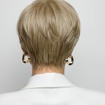 Back view of a blonde short wig with layered styling for a sophisticated look.