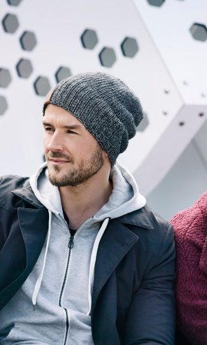 Stylish winter hats for men and women in urban setting.
