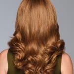 A stunning auburn wavy wig with soft curls, perfect for a natural look.