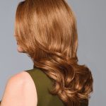 Beautiful auburn wavy wig showcasing natural shine and volume for a stylish look.