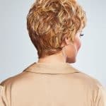 Short curly wig in warm blonde tones for women.