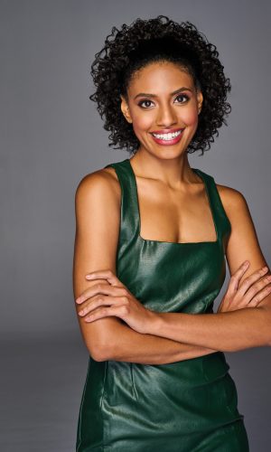 Beautiful woman with natural curly hair in a coily cinched ponytail.