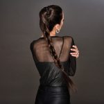 Woman with long, thick braid hairstyle from Hidden Secrets Wigs.