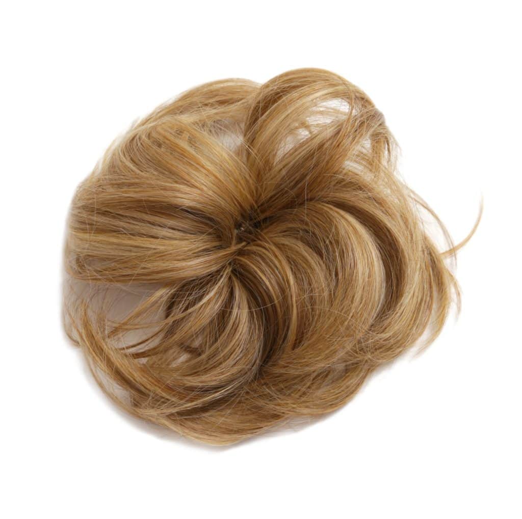 Blonde hair styled in a neat bun for elegant chignon hairstyle.