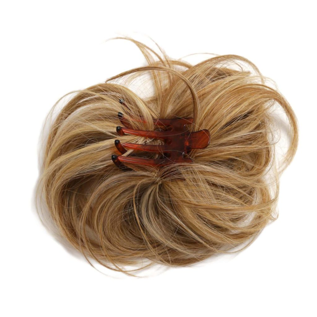 Blonde hair styled in a bun with a brown hair clip for a modern look.