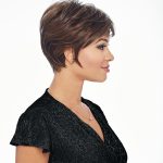 Short brown pixie wig styled on a woman with side profile view.