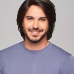 Man with stylish, well-groomed wig for a natural look.