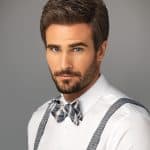Stylish man with well-groomed hair and bow tie, professional look.