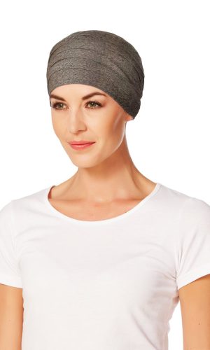 Gray turban headwrap worn by a woman with a white t-shirt.