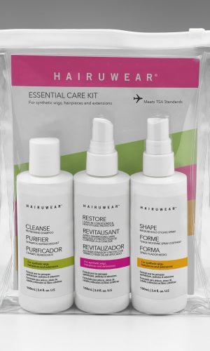 Travel-sized wig care kit with shampoo, conditioner, and styling spray in clear bag.