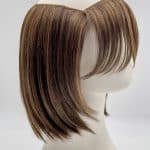 Brown layered bob wig with side-swept bangs on a mannequin head.