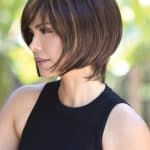 Stylish short brown wig with subtle highlights for a natural look.