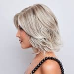 Blonde layered wig with soft waves from Hidden Secrets Wigs.