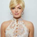 Blonde short wig styled on a woman with a floral halter top for a natural look.