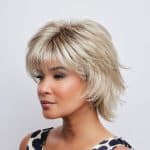Blonde layered wig with textured style from Hidden Secrets Wigs.