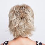 Blonde layered wig from the Noriko Collection, styled for a natural look.