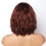 Red wavy wig from Hidden Secrets Wigs, Liana style, on a model.