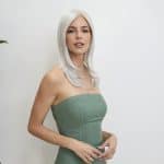 Elegant woman with platinum blonde wig from Hidden Secrets Wigs.