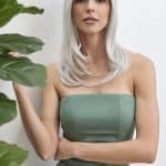 Elegant woman with long silver wig from Hidden Secrets Wigs.