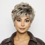 Short, textured blonde wig with layered curls for a stylish look.