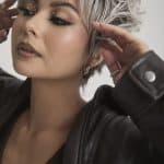 Stylish short silver wig with textured layers for a modern look.