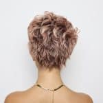 Curly short wig in soft pink shades from Hidden Secrets Wigs.