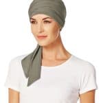 Women wearing a stylish olive green short scarf with a white top.