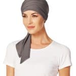 Women wearing a stylish gray short scarf with a white top.